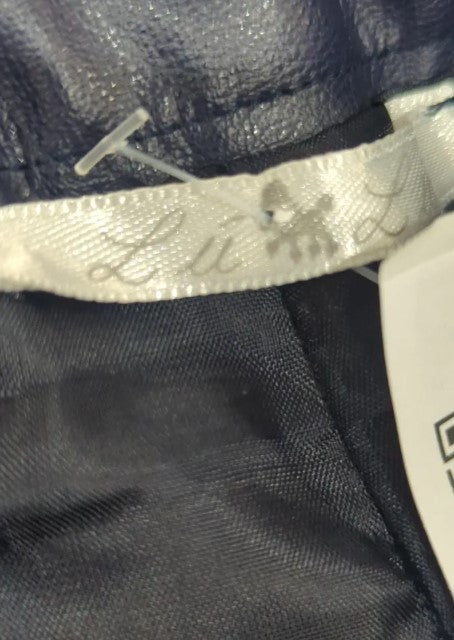 Short cuerina azul petróleo